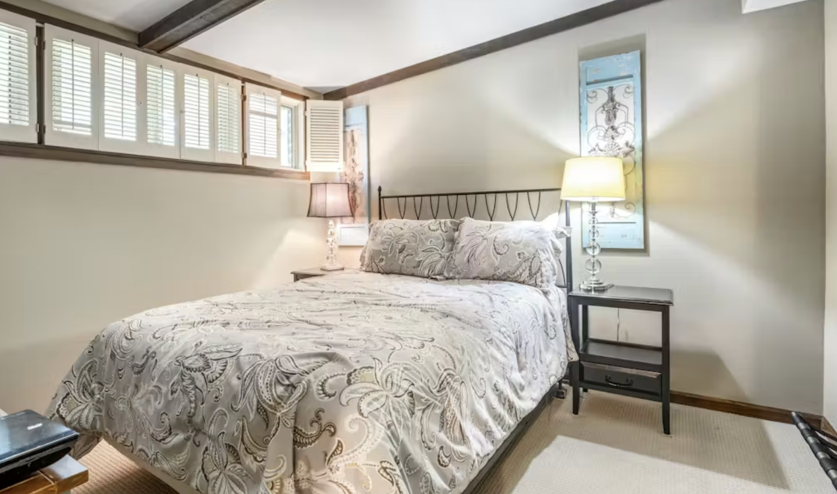 Stylish vacation rental bedroom with blue accent wall
